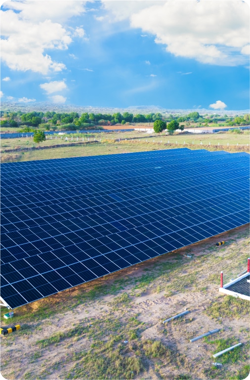Solar panel field under blue sky